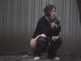 your voyeur videos - Girl in glasses caught peeing outdoors