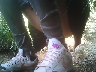 your voyeur videos - Girl in nike shoes squatting and peeing