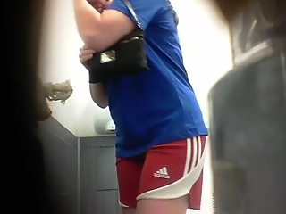 your voyeur videos - Woman in blue t-shirt and red sports peeing