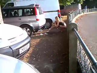 Piss – Woman pissing in public beyond some cars your voyeur videos - Woman pissing in public beyond some cars