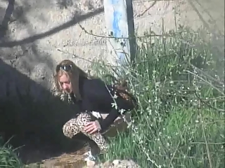 Piss – Woman in tiger pattern leggings pissing your voyeur videos - Woman in tiger pattern leggings pissing