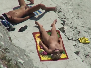 your voyeur videos - Nude couple secretly filmed in the rocky beach