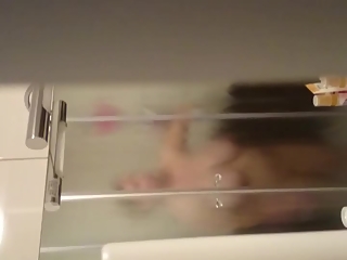 your voyeur videos - Husband secretly films wife taking shower