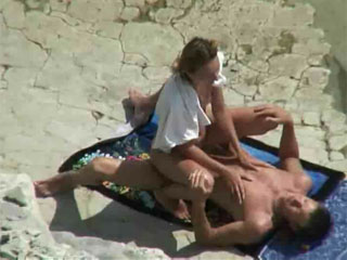 your voyeur videos - Naked mature woman sunbathing