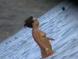 your voyeur videos - Nude gal in the beach